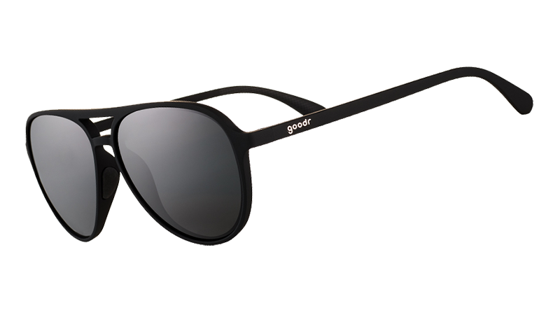 Three-quarter angle view of black aviator sunglasses with black non-reflective lenses.