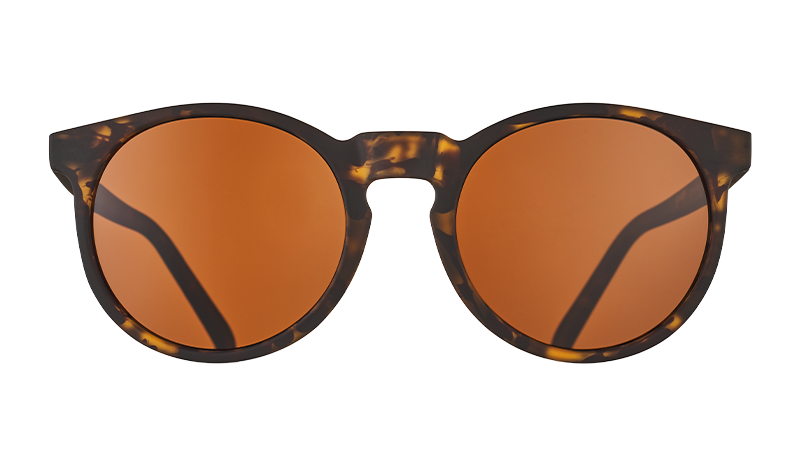 Front view of round brown tortoiseshell sunglasses with circle-shaped brown non-reflective lenses.