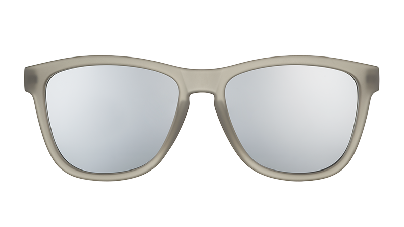 Front view of square-shaped sunglasses with translucent dark gray frames and gray polarised lenses.